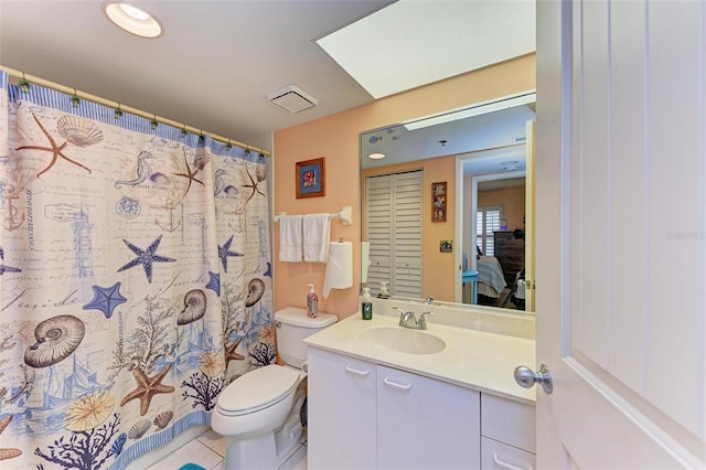 bathroom with tile patterned floors, vanity, and toilet