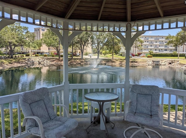 exterior space featuring a gazebo and a water view