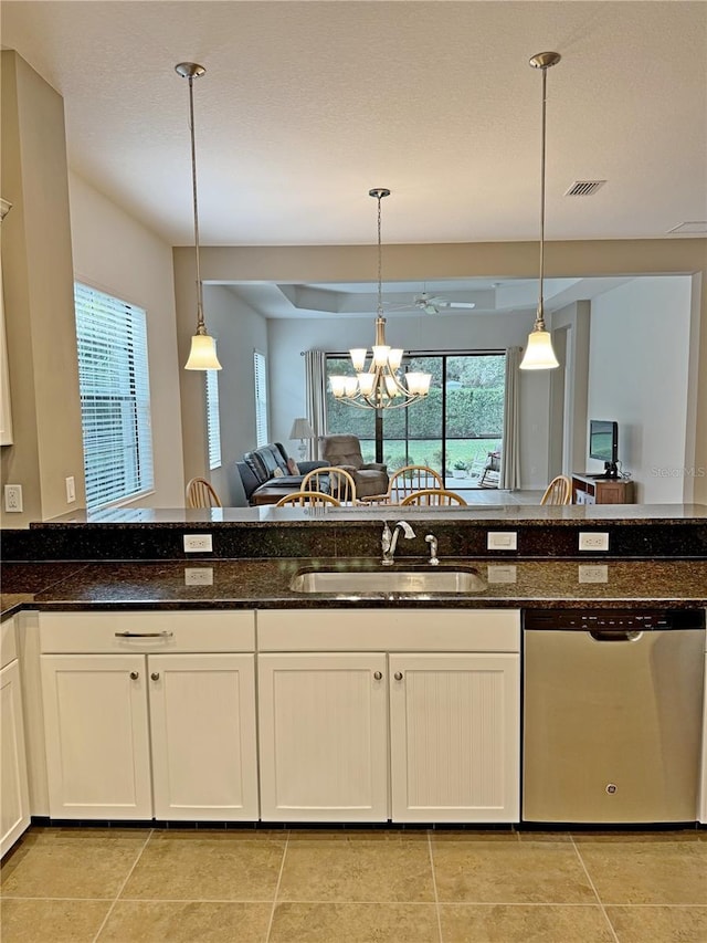 kitchen with dishwasher, plenty of natural light, hanging light fixtures, and sink