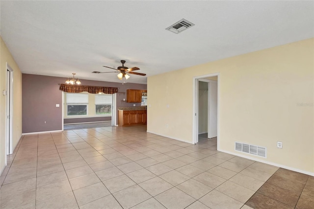 unfurnished living room with light tile patterned floors and ceiling fan with notable chandelier