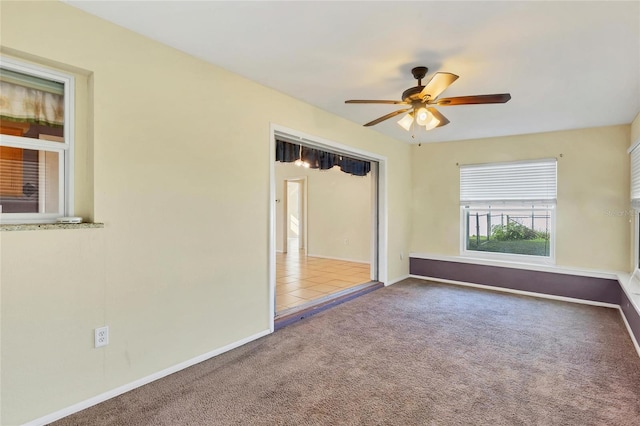 unfurnished bedroom featuring carpet flooring, ceiling fan, and a closet