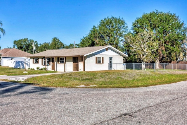 single story home with fence and a front yard