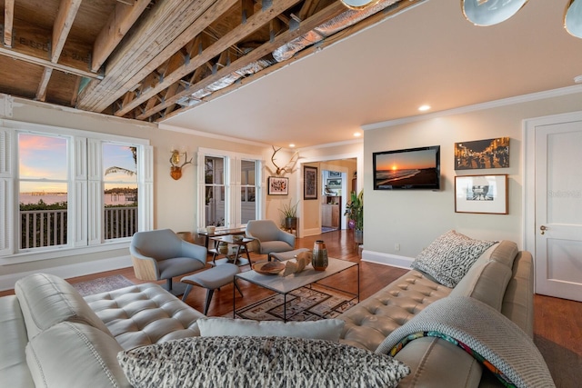 living area with ornamental molding, recessed lighting, wood finished floors, and baseboards