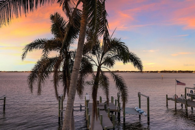 view of water feature with a dock and boat lift