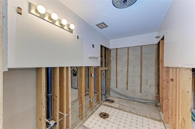 bathroom featuring a textured ceiling