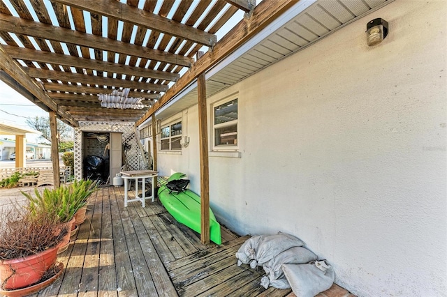 wooden terrace with a pergola