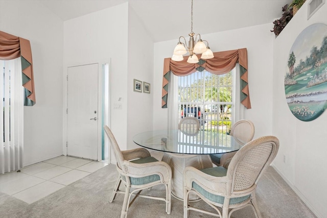 tiled dining area with a notable chandelier