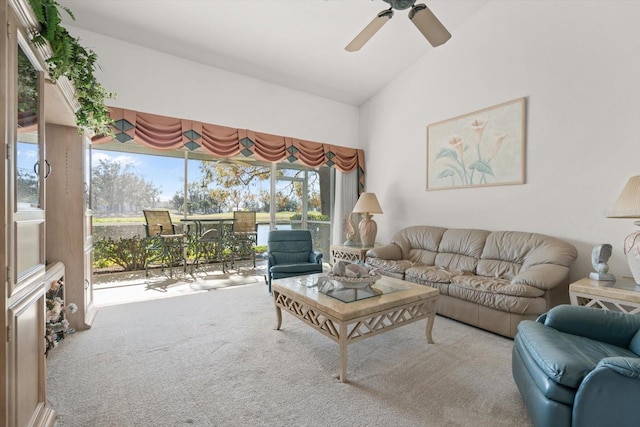 living room with carpet floors, vaulted ceiling, and ceiling fan