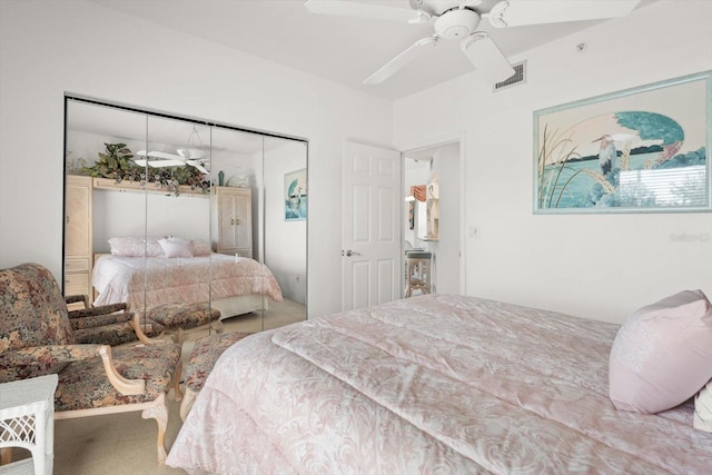 bedroom with ceiling fan and a closet