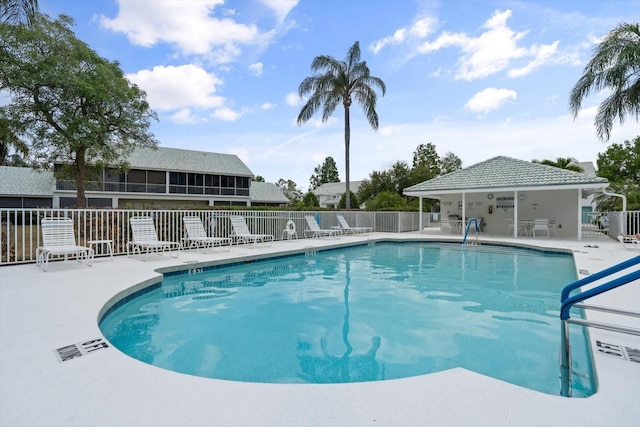 view of swimming pool with a patio area