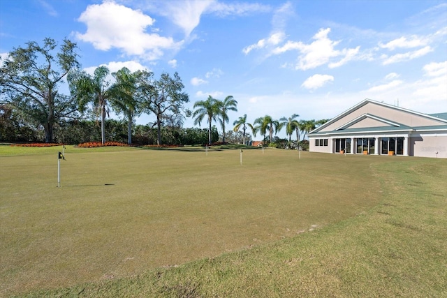 view of property's community with a yard