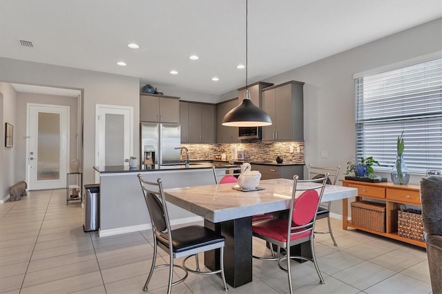 tiled dining space with sink