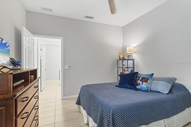 tiled bedroom with ceiling fan