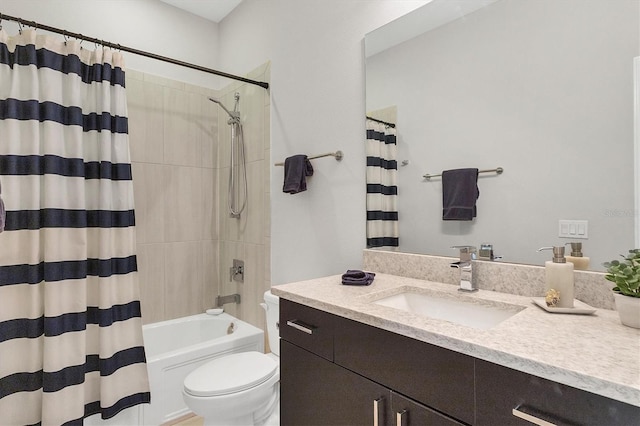 full bathroom with shower / tub combo, vanity, and toilet