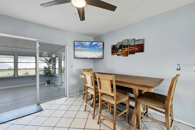 dining room with light hardwood / wood-style floors and ceiling fan