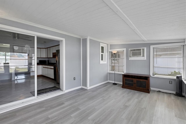 unfurnished living room featuring lofted ceiling with beams, a wall unit AC, light wood-type flooring, and wood ceiling