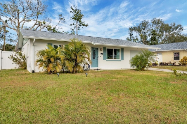 ranch-style house featuring a front yard