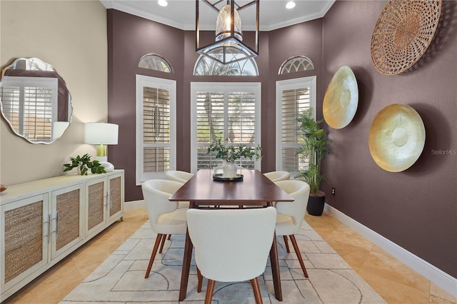 dining room featuring light tile patterned flooring, baseboards, crown molding, and recessed lighting