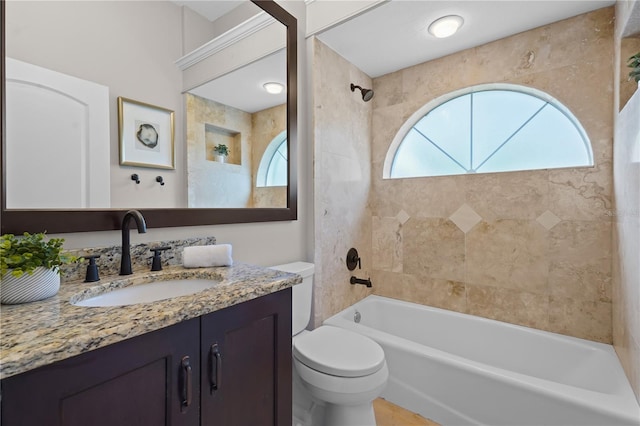 full bath featuring toilet, bathtub / shower combination, and vanity