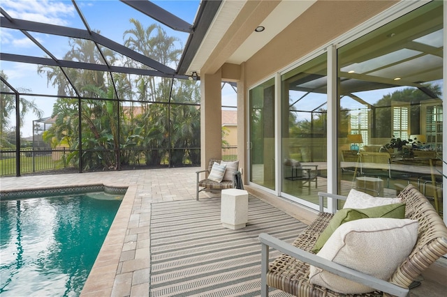 pool with a patio and glass enclosure