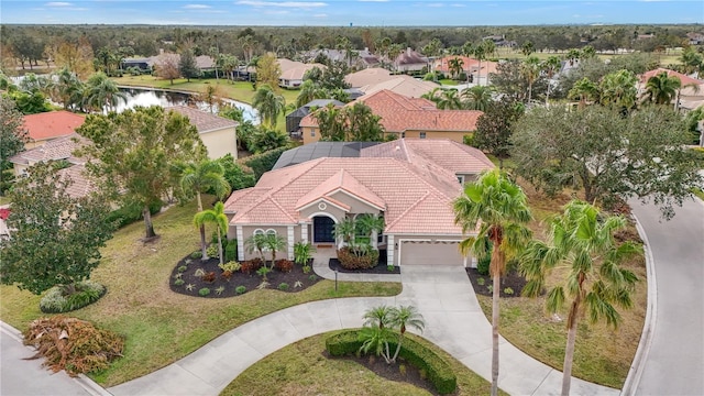 bird's eye view with a water view and a residential view