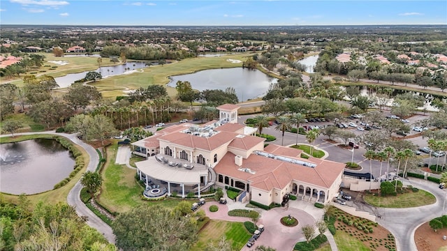 drone / aerial view featuring a water view and golf course view