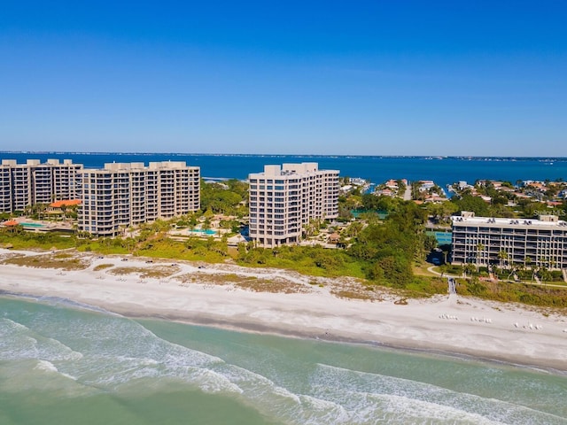 aerial view featuring a view of the beach and a water view