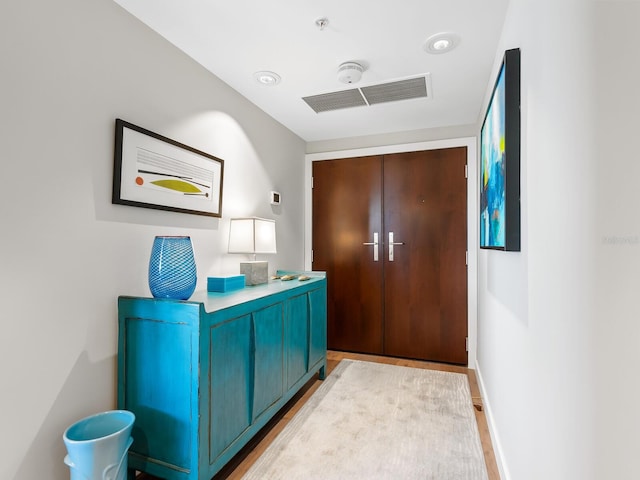 foyer with light hardwood / wood-style flooring