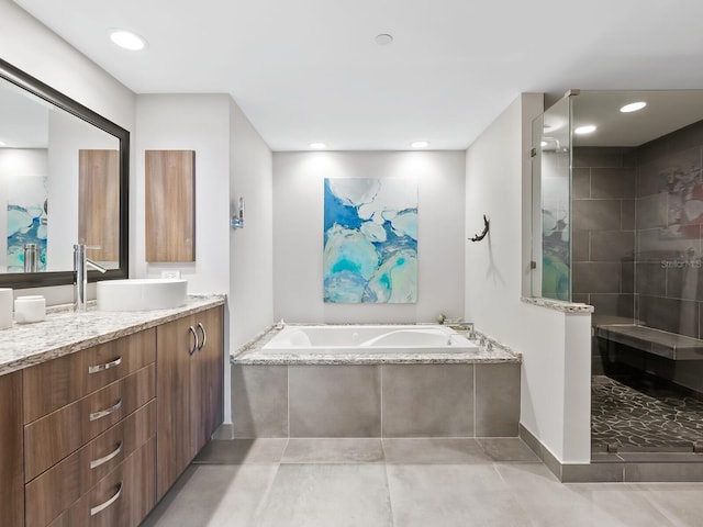 bathroom with vanity and plus walk in shower