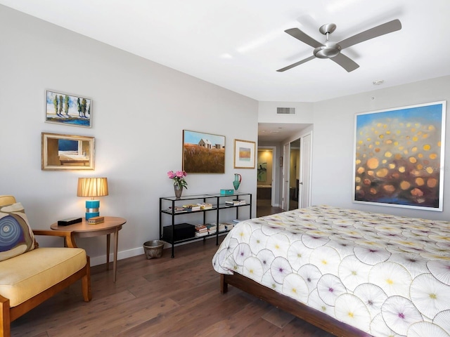 bedroom with ceiling fan and dark hardwood / wood-style flooring