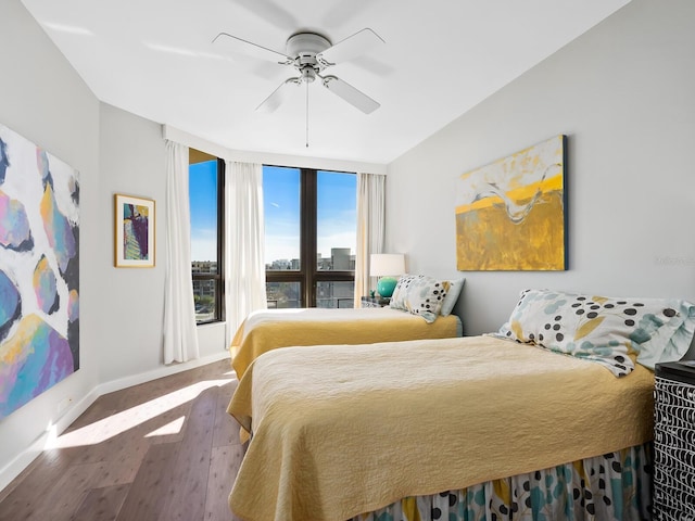 bedroom featuring ceiling fan and hardwood / wood-style flooring