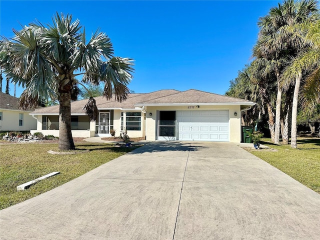 ranch-style home with a front lawn and a garage