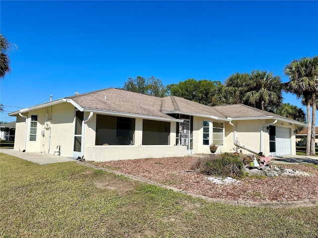 view of front of home with a garage and a front yard