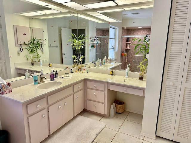 bathroom featuring vanity, tile patterned floors, and an enclosed shower