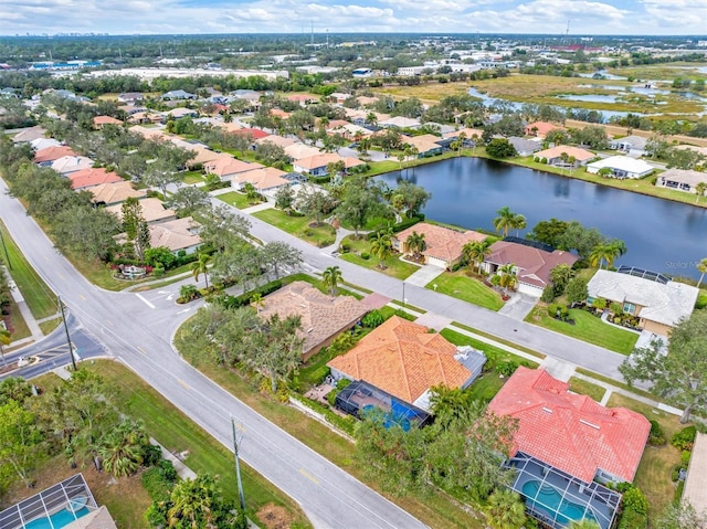 drone / aerial view with a water view