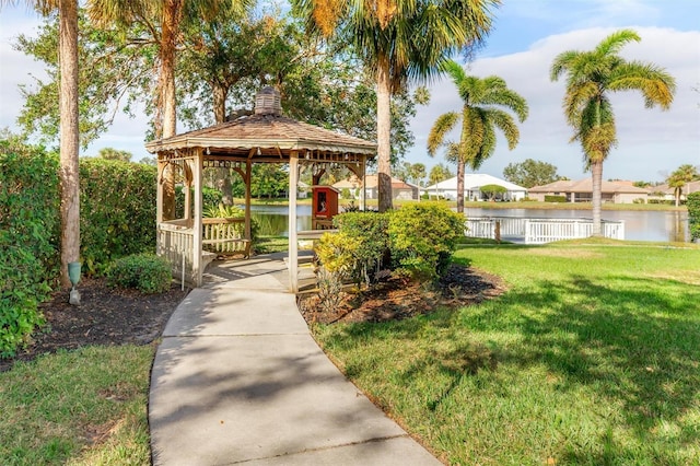 view of yard with a gazebo and a water view