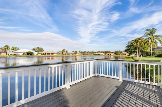 wooden deck featuring a water view