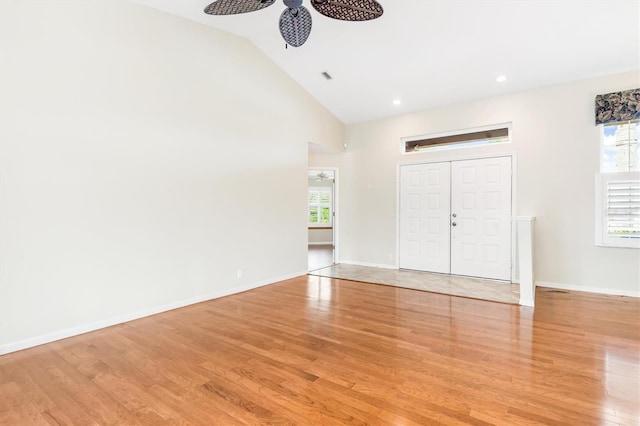 interior space featuring high vaulted ceiling, light hardwood / wood-style floors, and a wealth of natural light