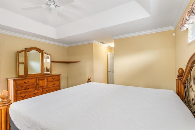 bedroom featuring ceiling fan, ornamental molding, and a raised ceiling