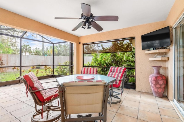 sunroom with ceiling fan and plenty of natural light