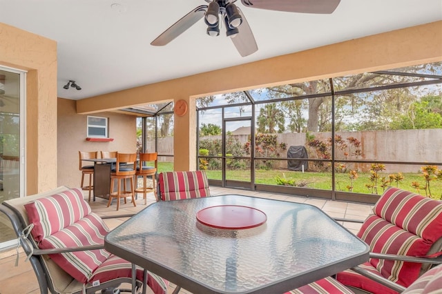 sunroom / solarium with ceiling fan