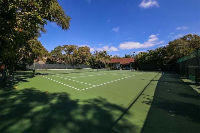 view of sport court with fence