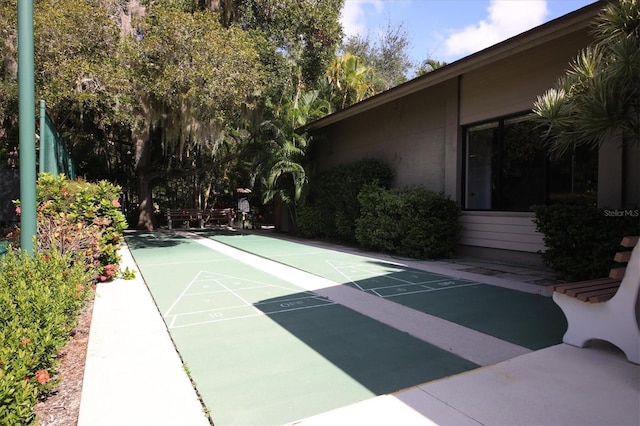 view of home's community with shuffleboard