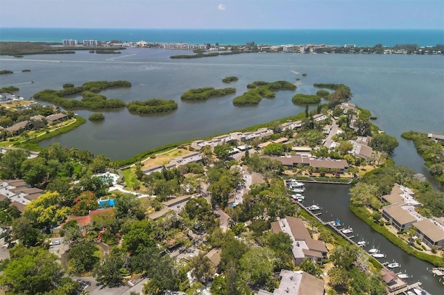 drone / aerial view featuring a residential view and a water view