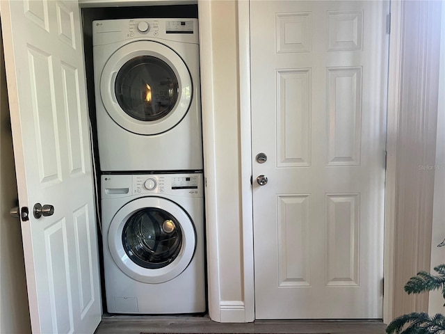 laundry area with laundry area and stacked washing maching and dryer