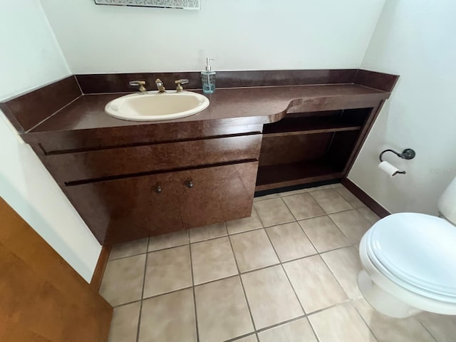 bathroom with tile patterned floors, vanity, and toilet