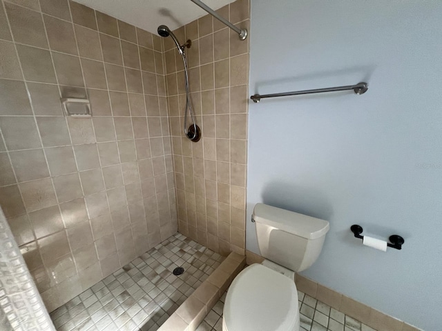 bathroom featuring toilet, tile patterned flooring, and walk in shower