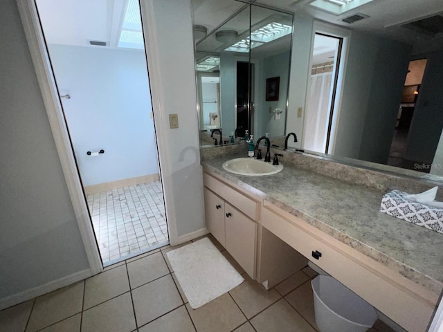 bathroom with tile patterned floors and vanity