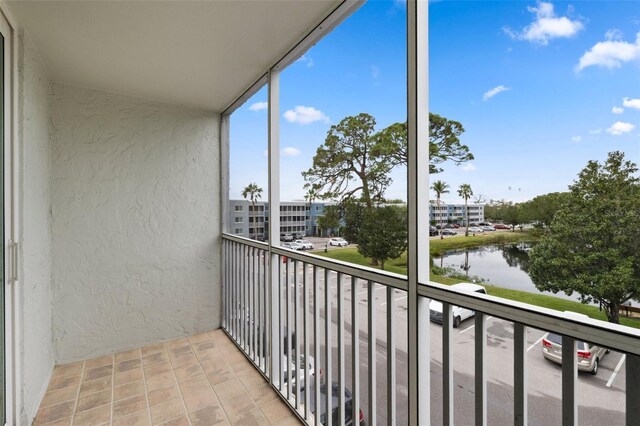 balcony featuring a water view