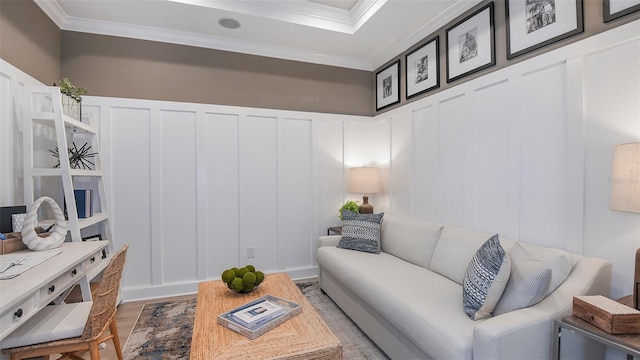 living room with wood-type flooring and crown molding